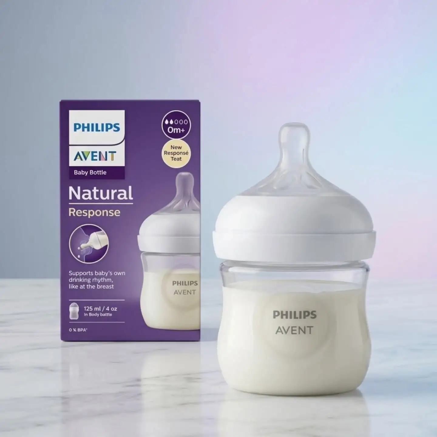 Philips Avent Natural Response 125ml clear baby bottle next to purple packaging.