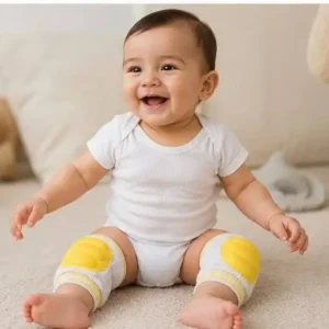 air of white baby crawling knee pads with soft light-yellow oval cushion padding and yellow-striped elastic trim.