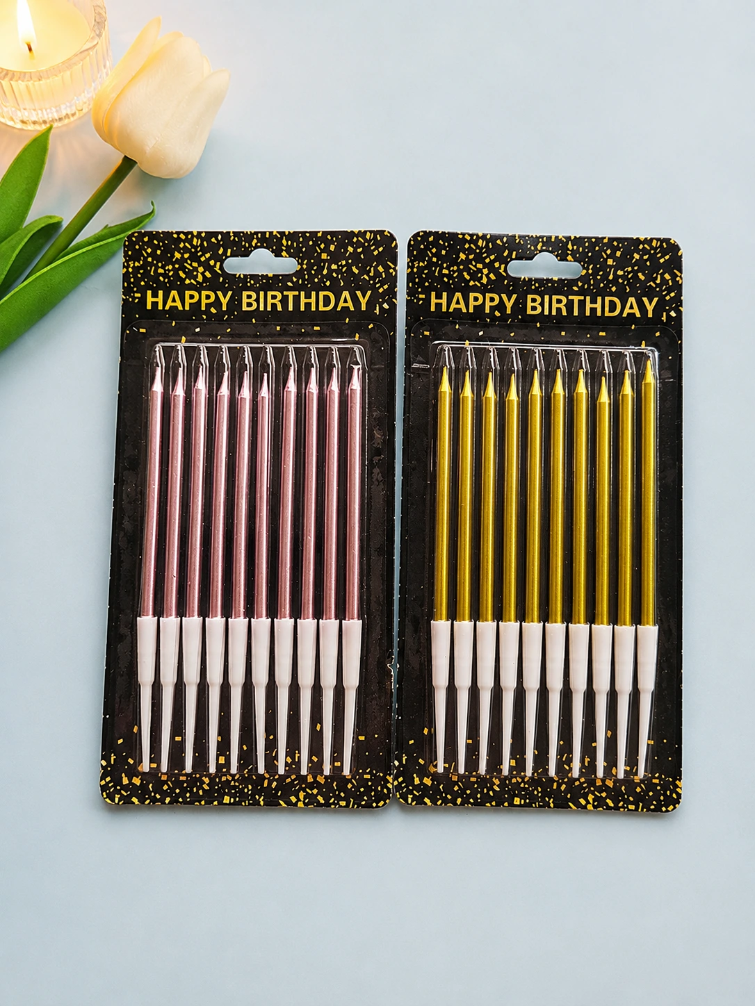 Metallic rose gold and gold thin pencil birthday candles in packaging