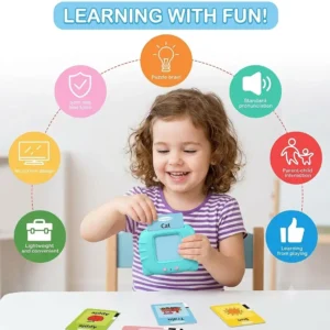 Toddler playing with interactive talking flash card reader toy