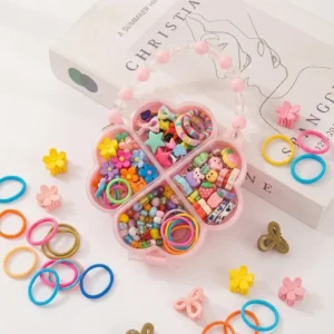 Four leaf clover shaped pink acrylic hair accessories storage box with beaded handle containing hair bands and mini claw clips.