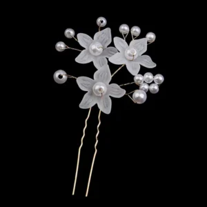 Pearl and frosted flower bridal hair pin against black background