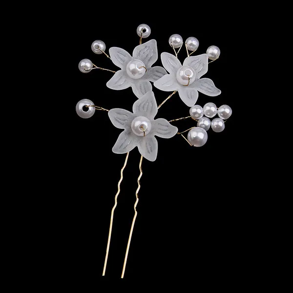 Pearl and frosted flower bridal hair pin against black background