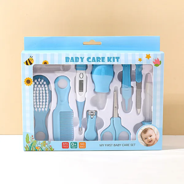 10-piece light blue baby care grooming kit box showing thermometer, scissors, brush, and clippers.
