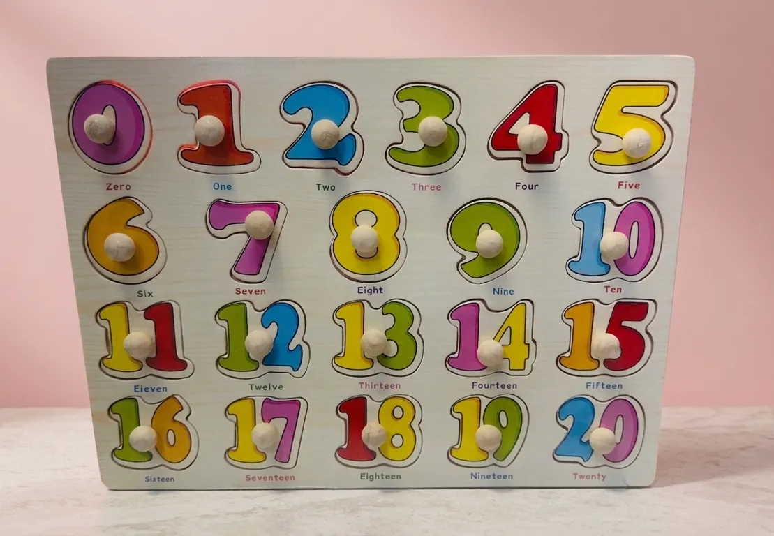 Wooden number peg puzzle board with numbers 0 to 20 painted in bright colors and fitted with wooden knobs.
