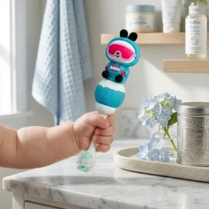 Baby holding a cute cartoon character training toothbrush with soft bristles.