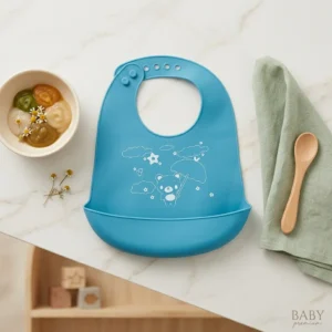 Soft silicone waterproof baby bib with deep food catcher pocket.